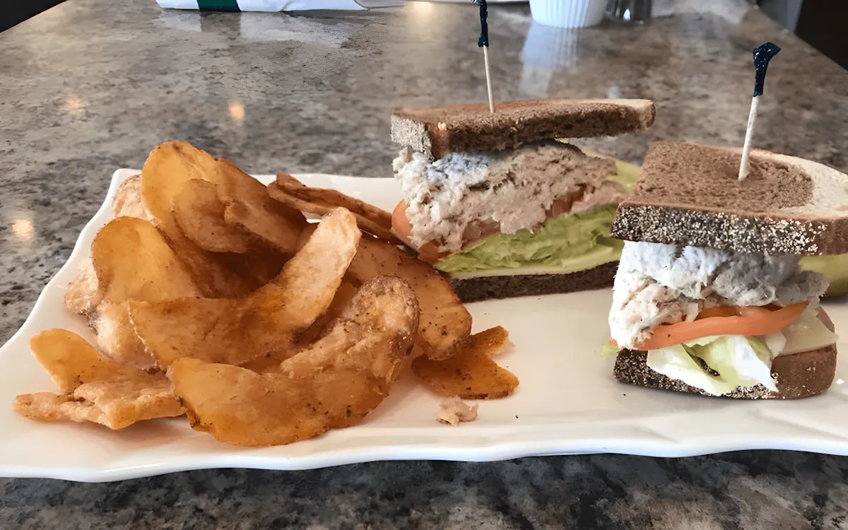 a half eaten sandwich on a plate