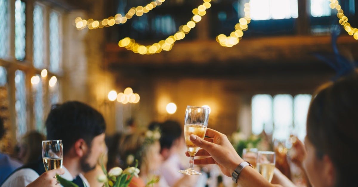 a person drinking a glass of wine