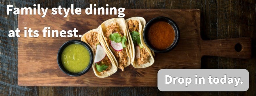 a bowl of food on a wooden table