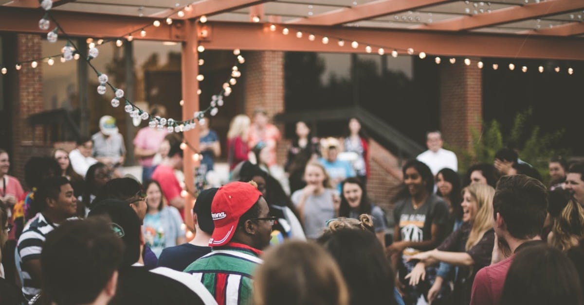 a group of people standing in front of a crowd