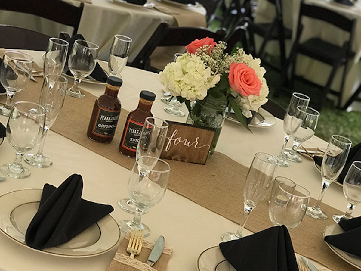 a group of people sitting at a table with wine glasses