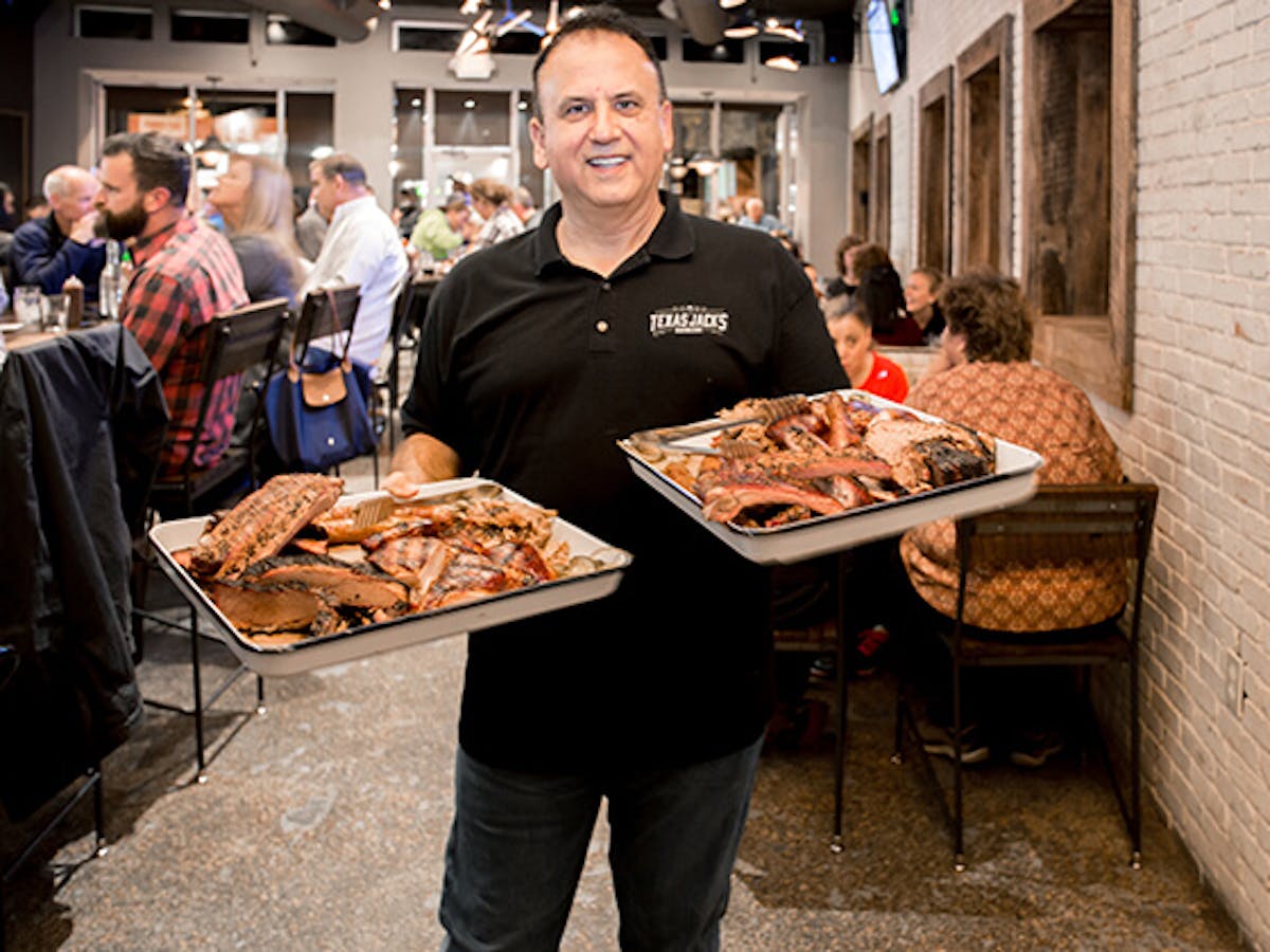 a person standing in front of a plate of food