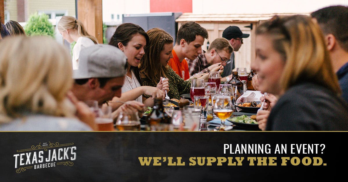 a group of people sitting at a table with wine glasses