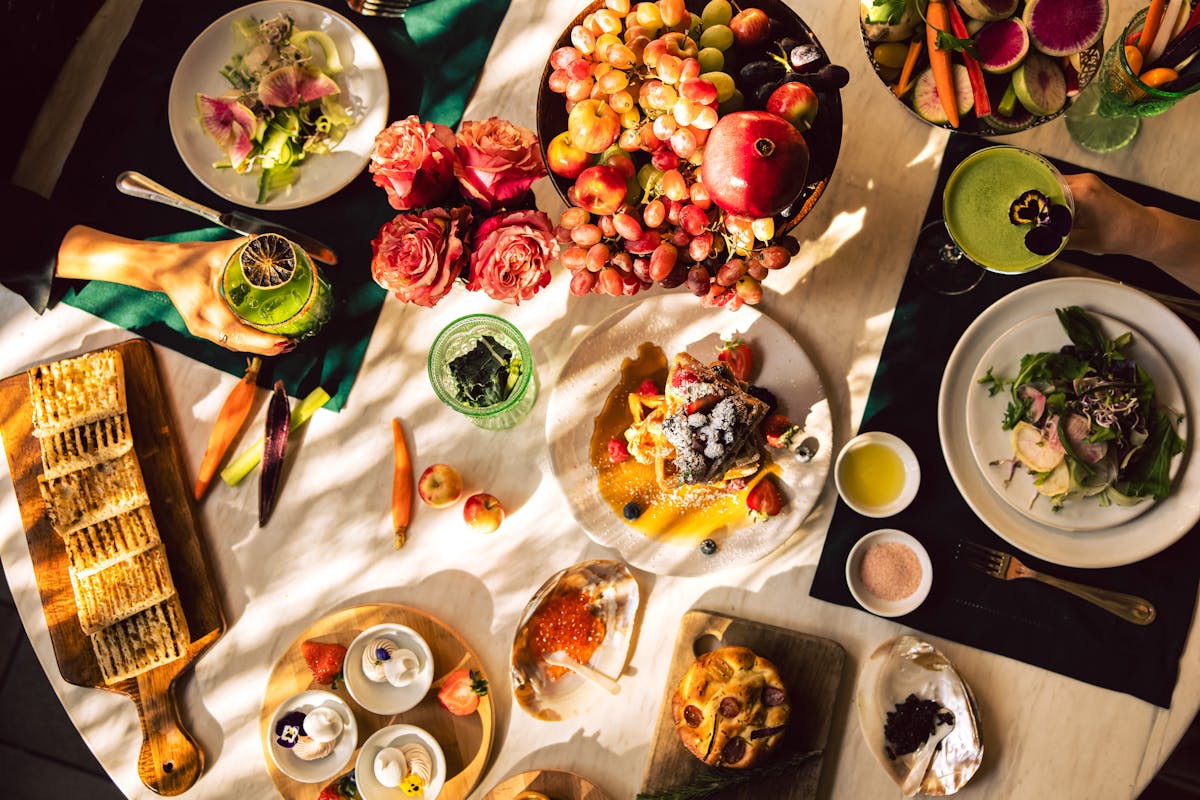 a bunch of different types of food on a table