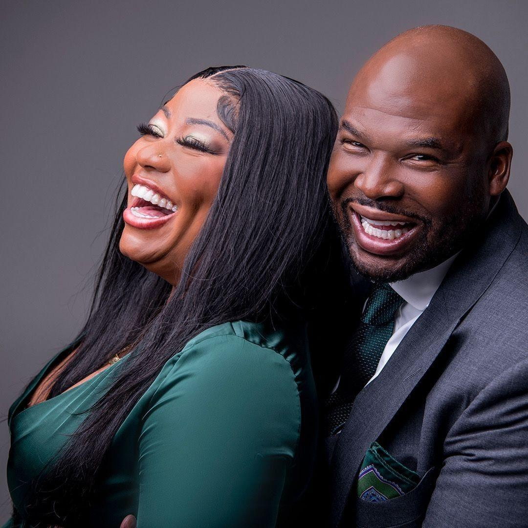 a woman and a man smiling for the camera