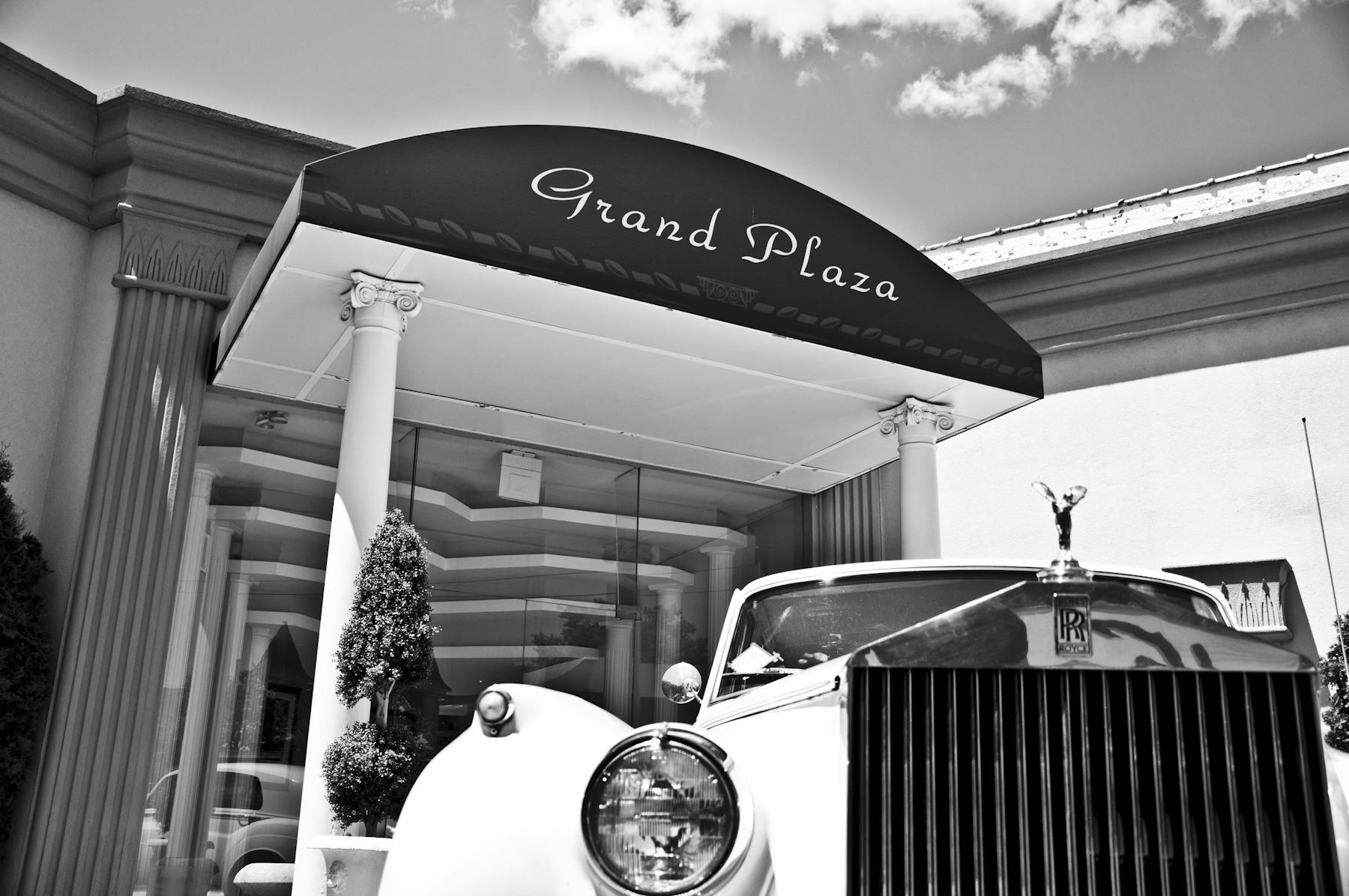 close up of a car in front of a building's entrance