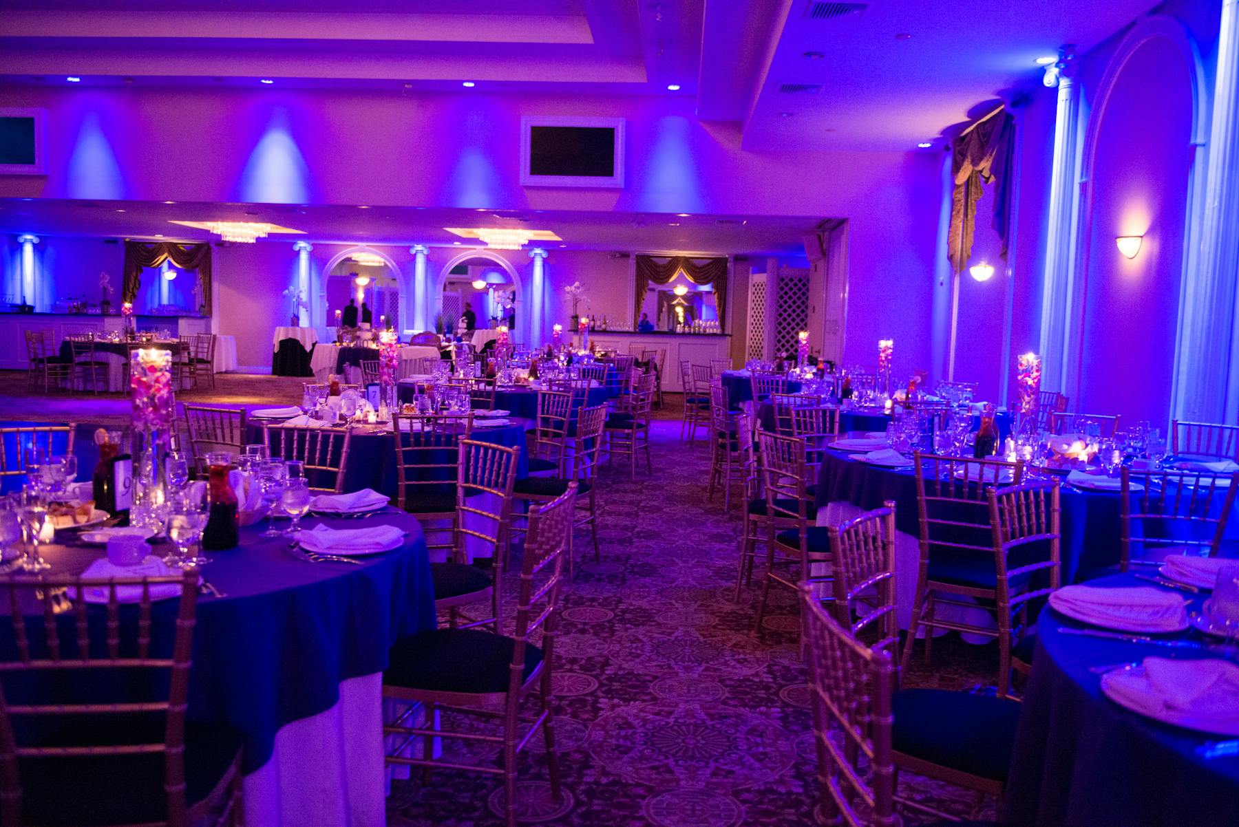 a room filled with decorated tables and chairs