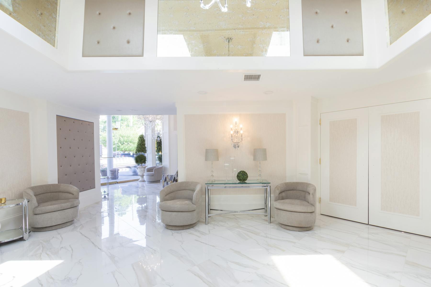renovated lobby with tufted wall and mirrors