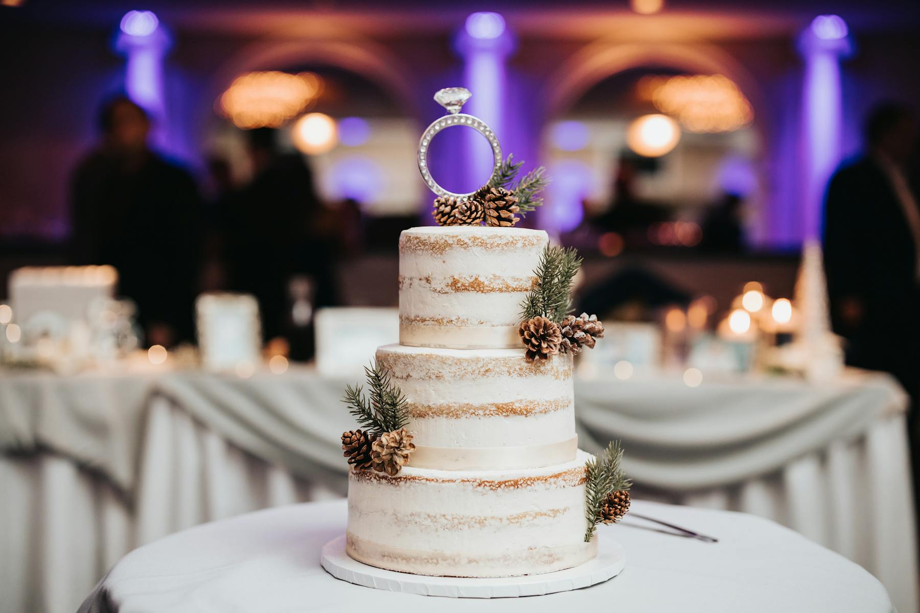 a large white cake sitting on top of a table