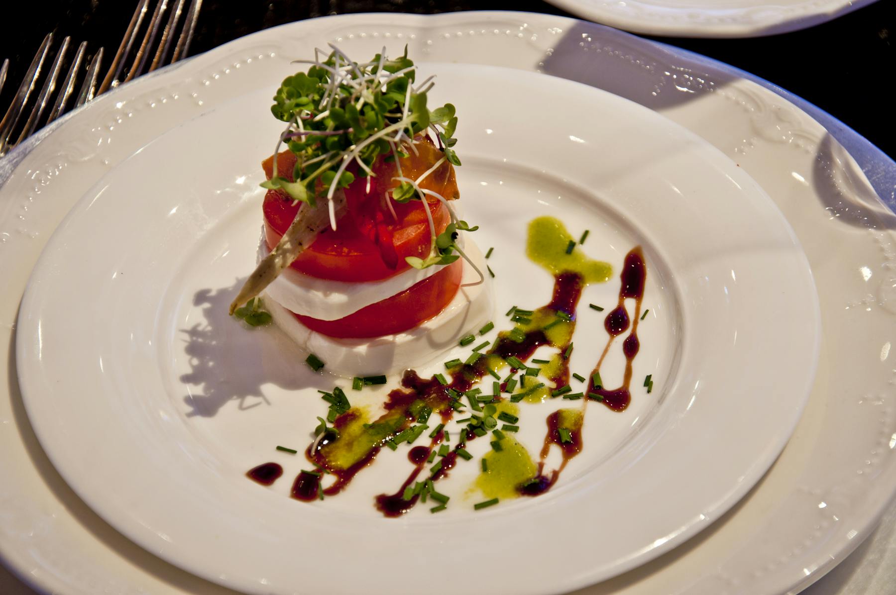 a white plate with salad on top
