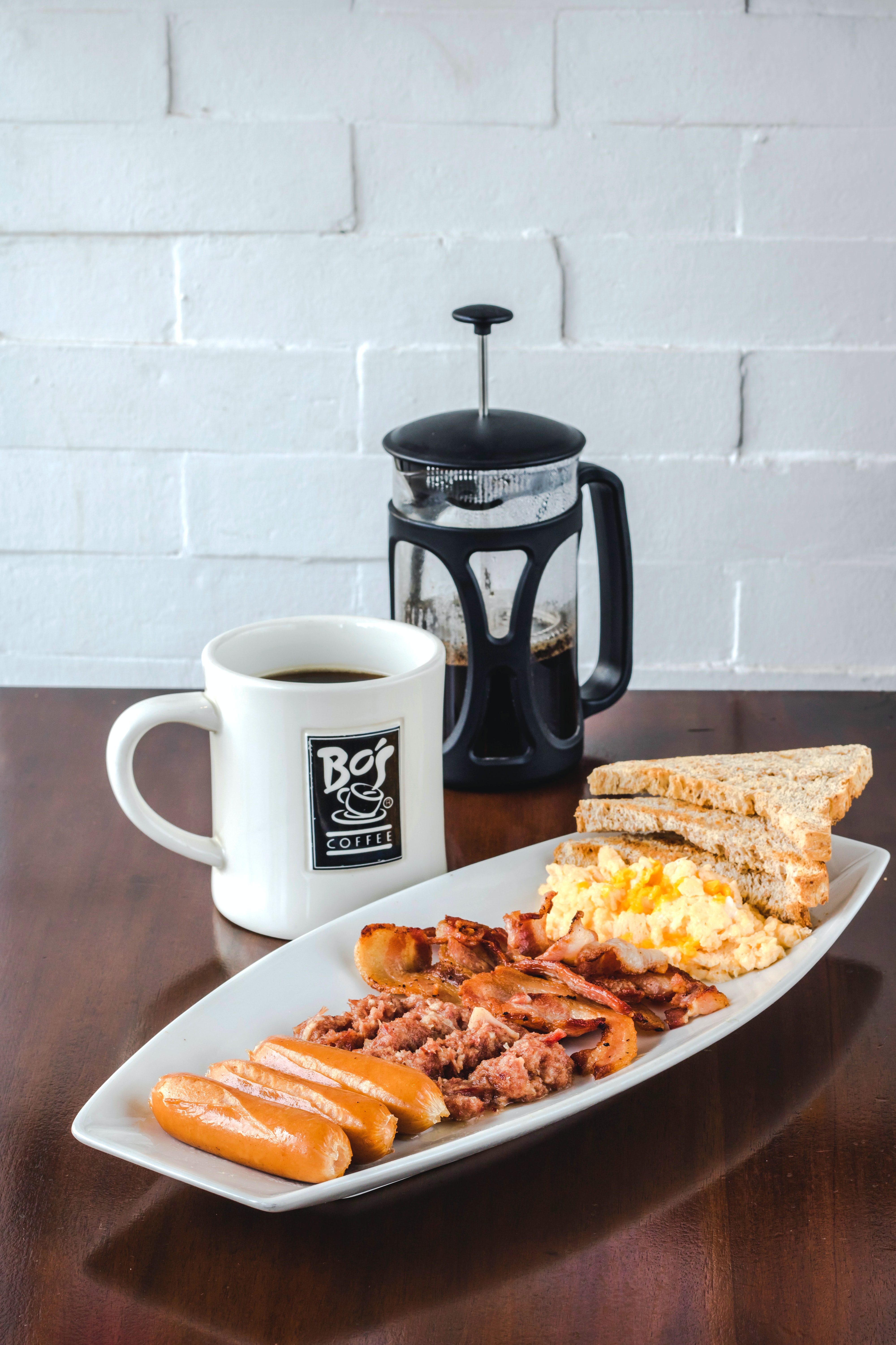 a plate of food and a cup of coffee on a table