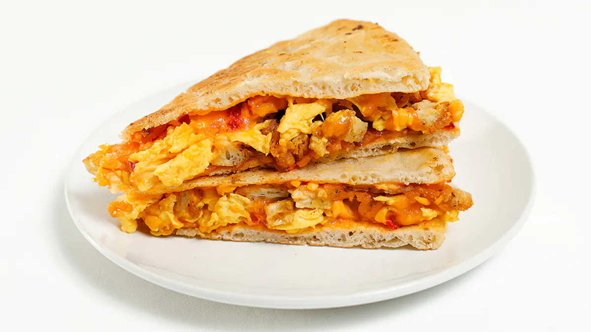 a sandwich cut in half on a plate