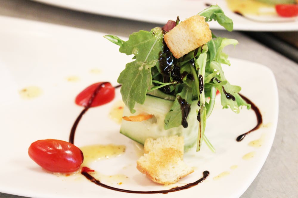 a plate with a sandwich and a salad