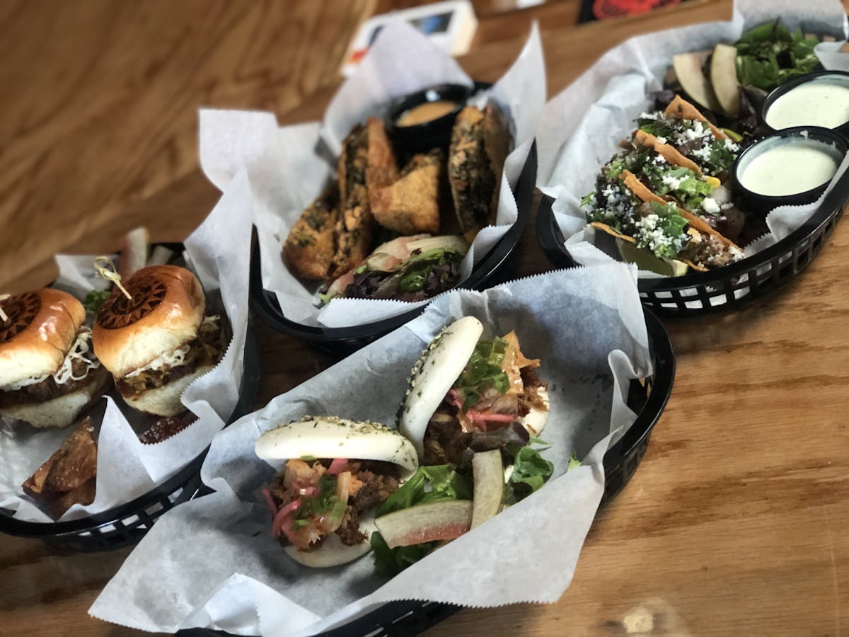 a sandwich sitting on top of a wooden table