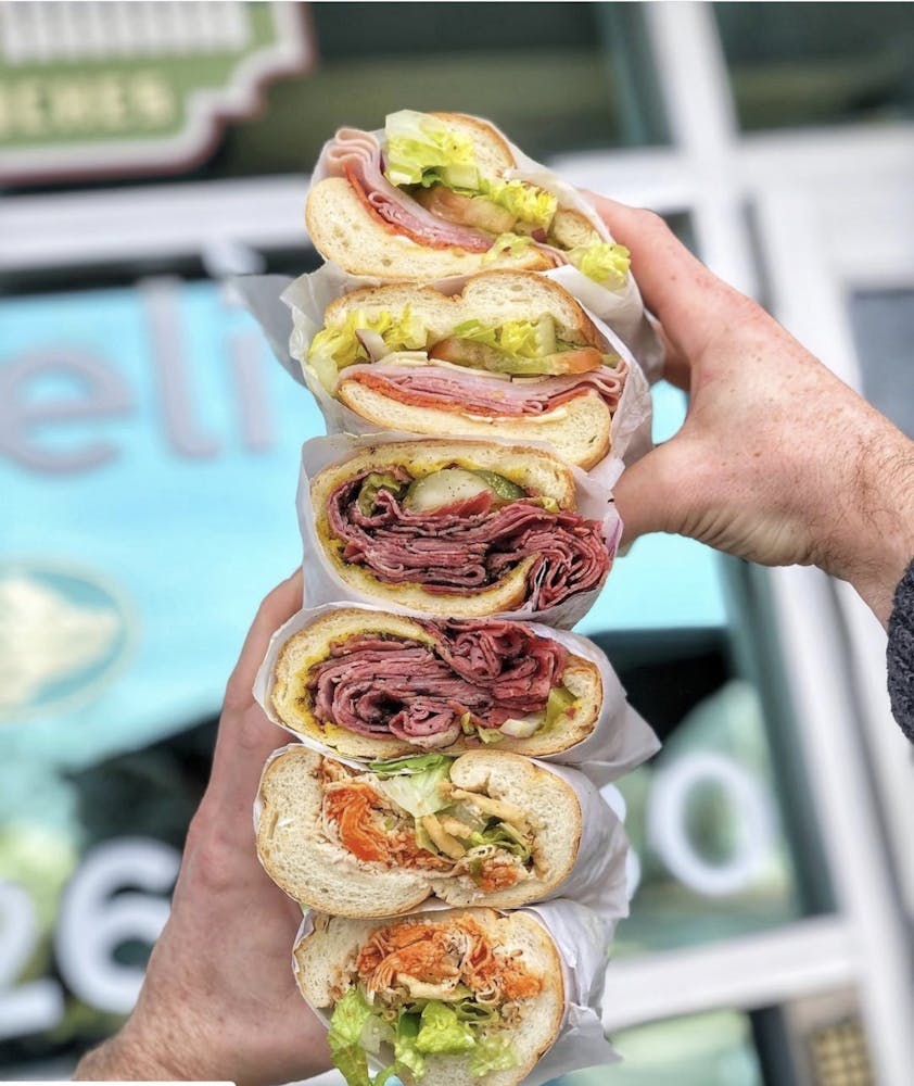 a person holding a hot dog