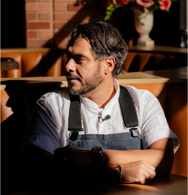 chef sitting at a table