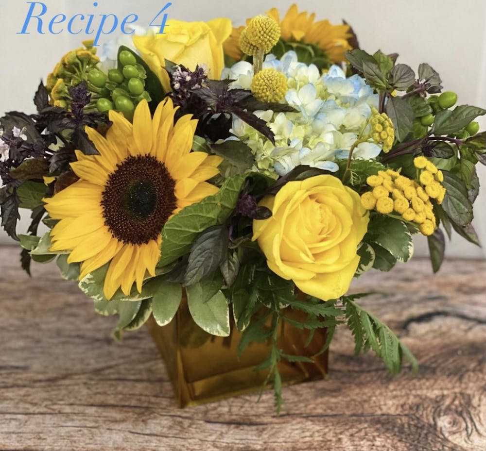 a bouquet of flowers in a vase on a table