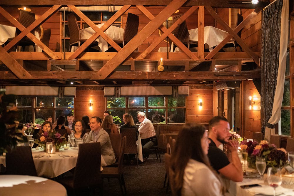 a group of people drinking wine at a restaurant