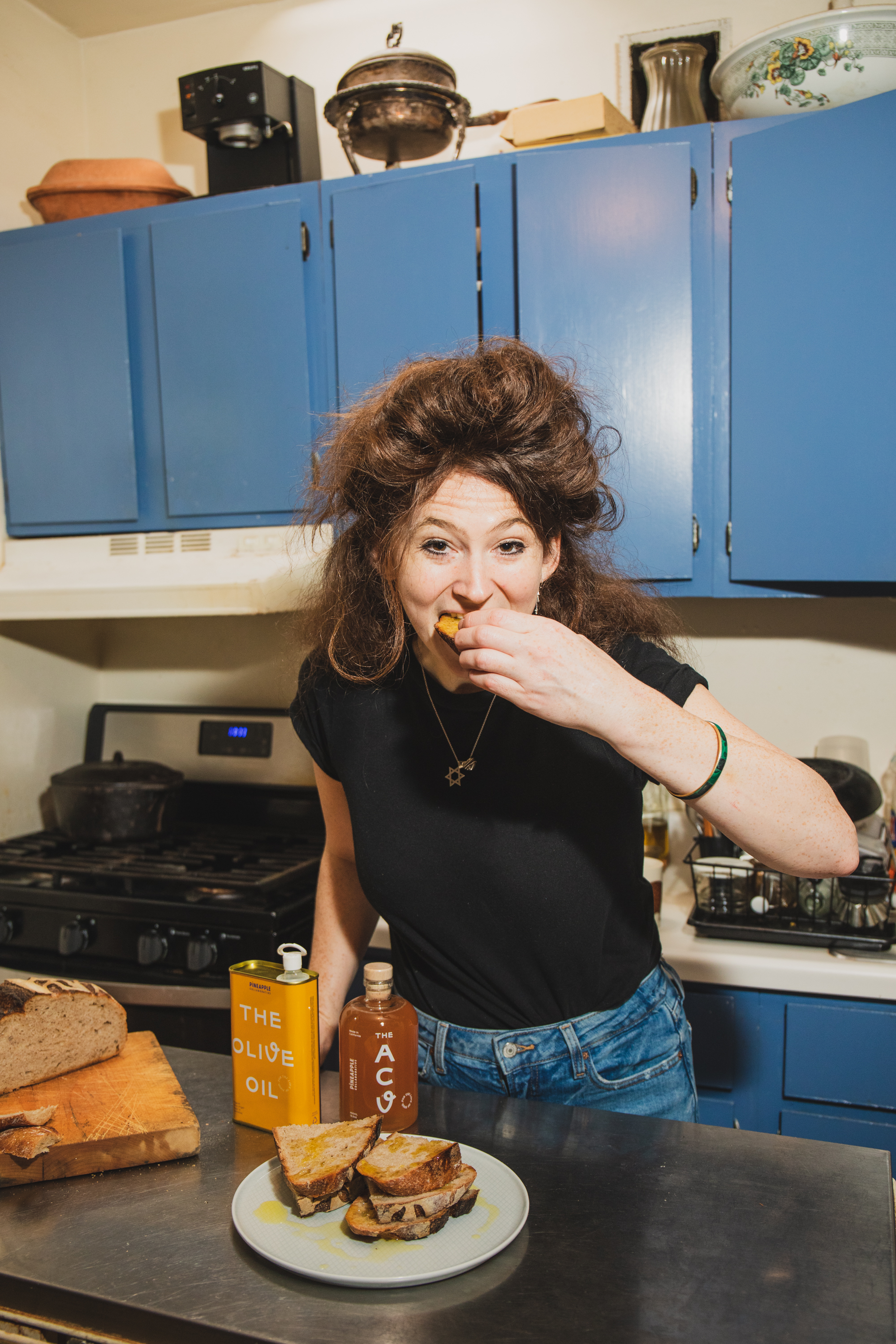 a woman standing in a kitchen