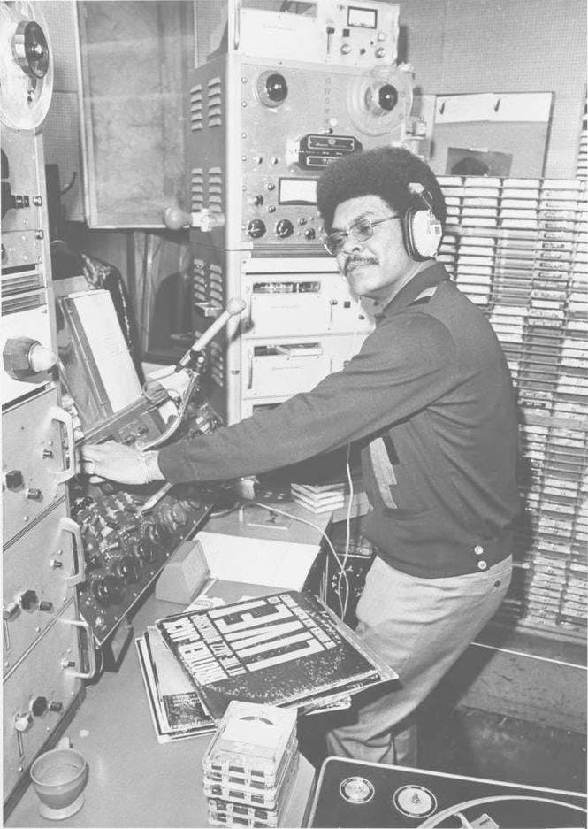a man standing in front of a computer