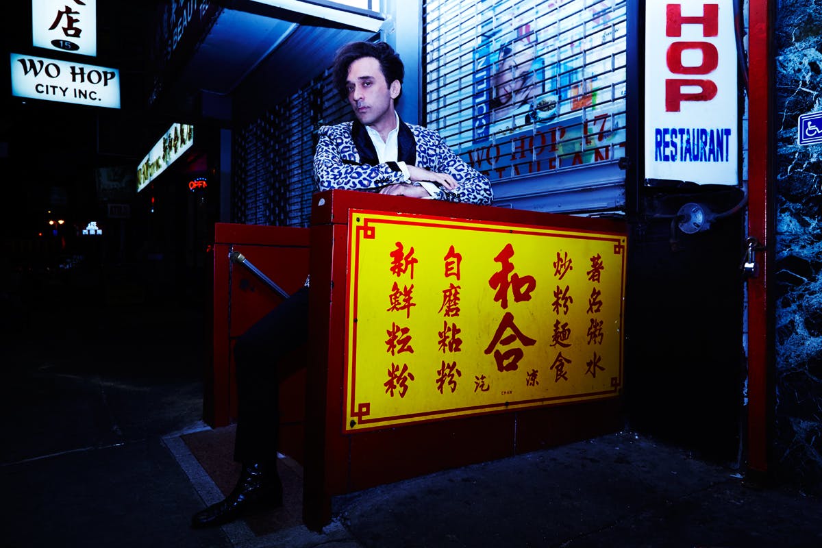 a person standing in front of a sign