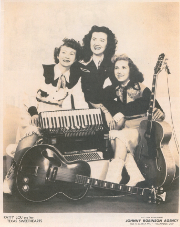 a group of women posing with instruments