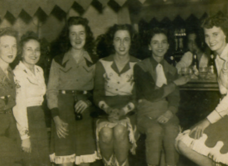 a group of people in black and white