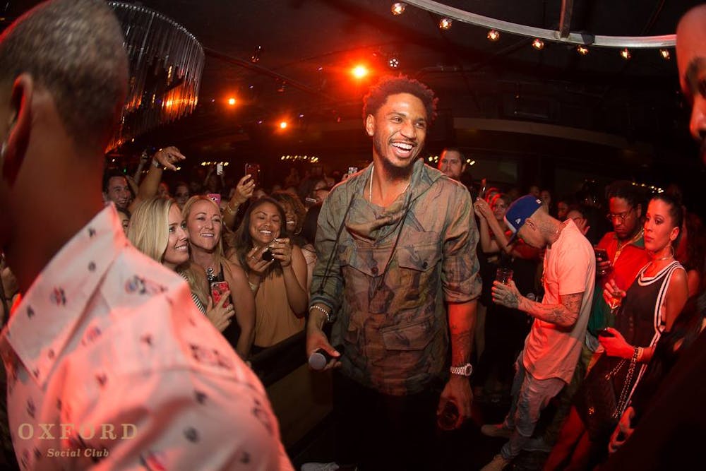Trey Songz et al. standing in front of a crowd