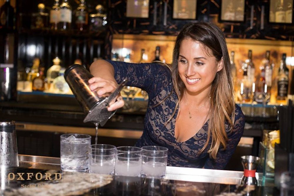 a woman standing in front of a restaurant