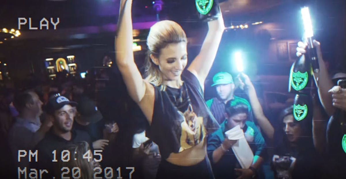 a person on a stage in front of a crowd