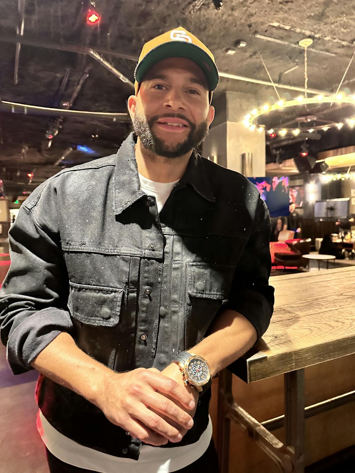Lance Moore wearing a hat and smiling at the camera