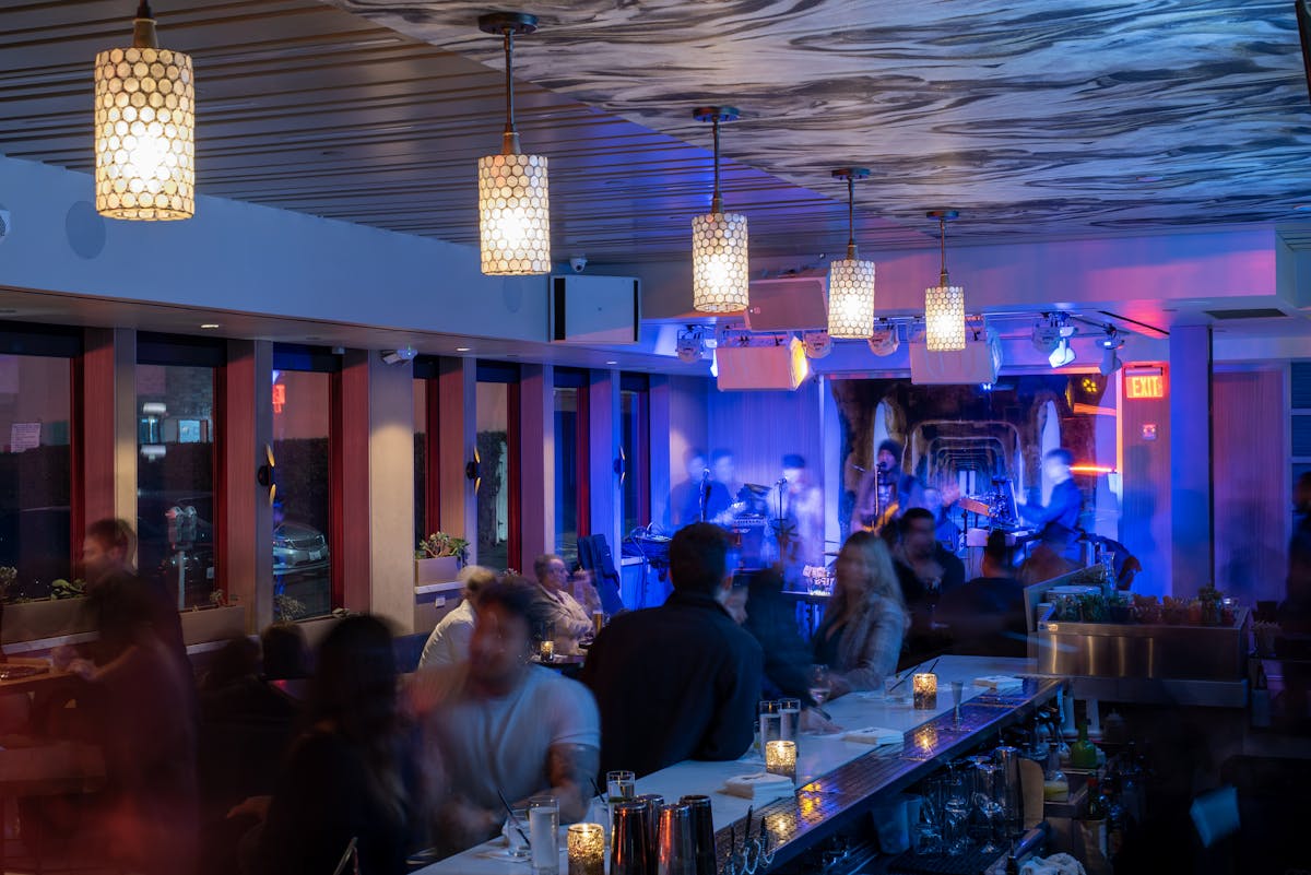 StrandBar with band at night