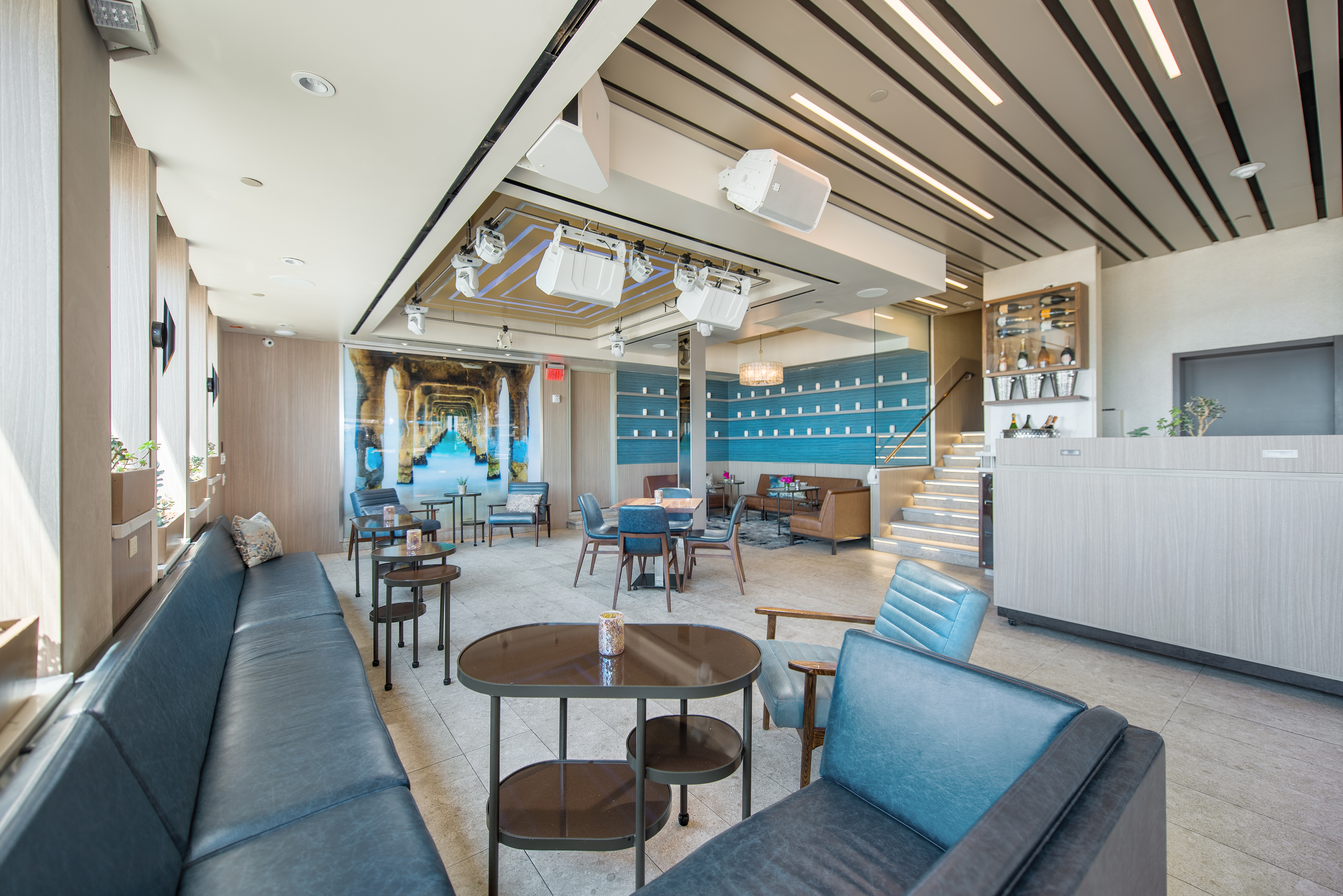 a bedroom with a bed and a chair in a room