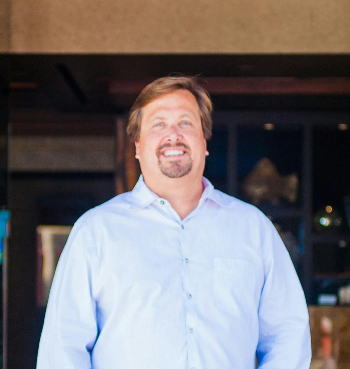 a man wearing a light blue shirt