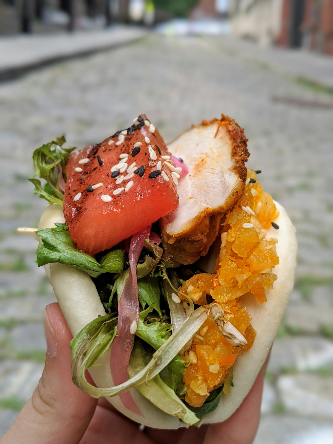 a sandwich with meat and vegetables