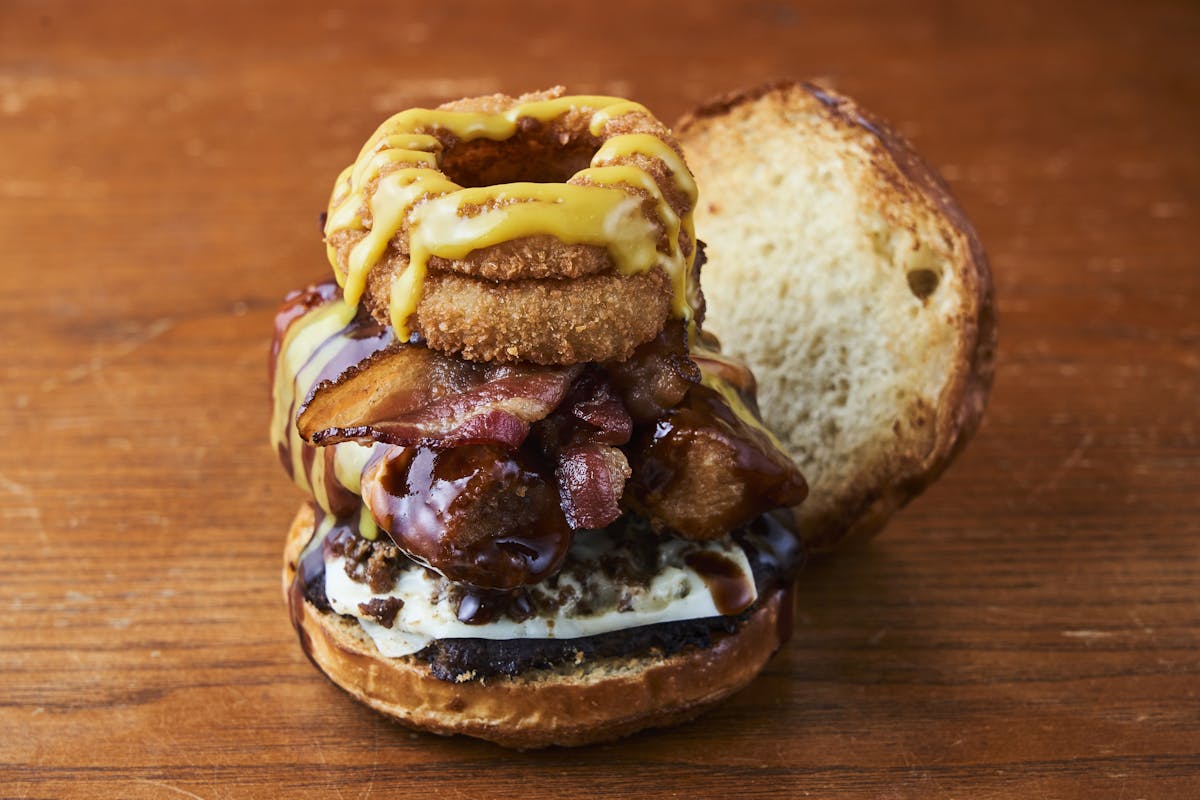 a close up of a sandwich sitting on top of a wooden table