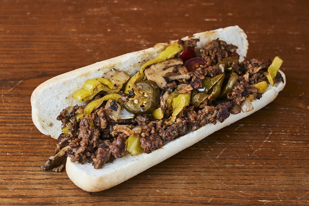 a sandwich sitting on top of a wooden table