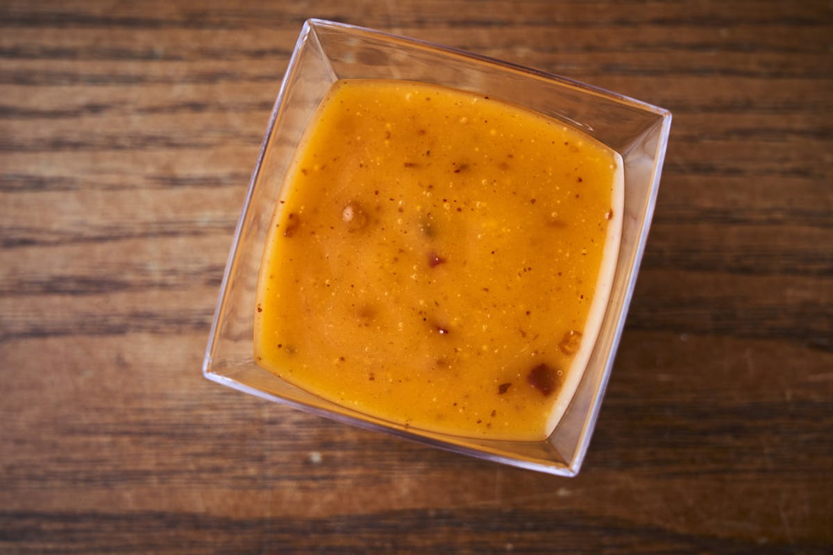 a bowl of food on a wooden surface