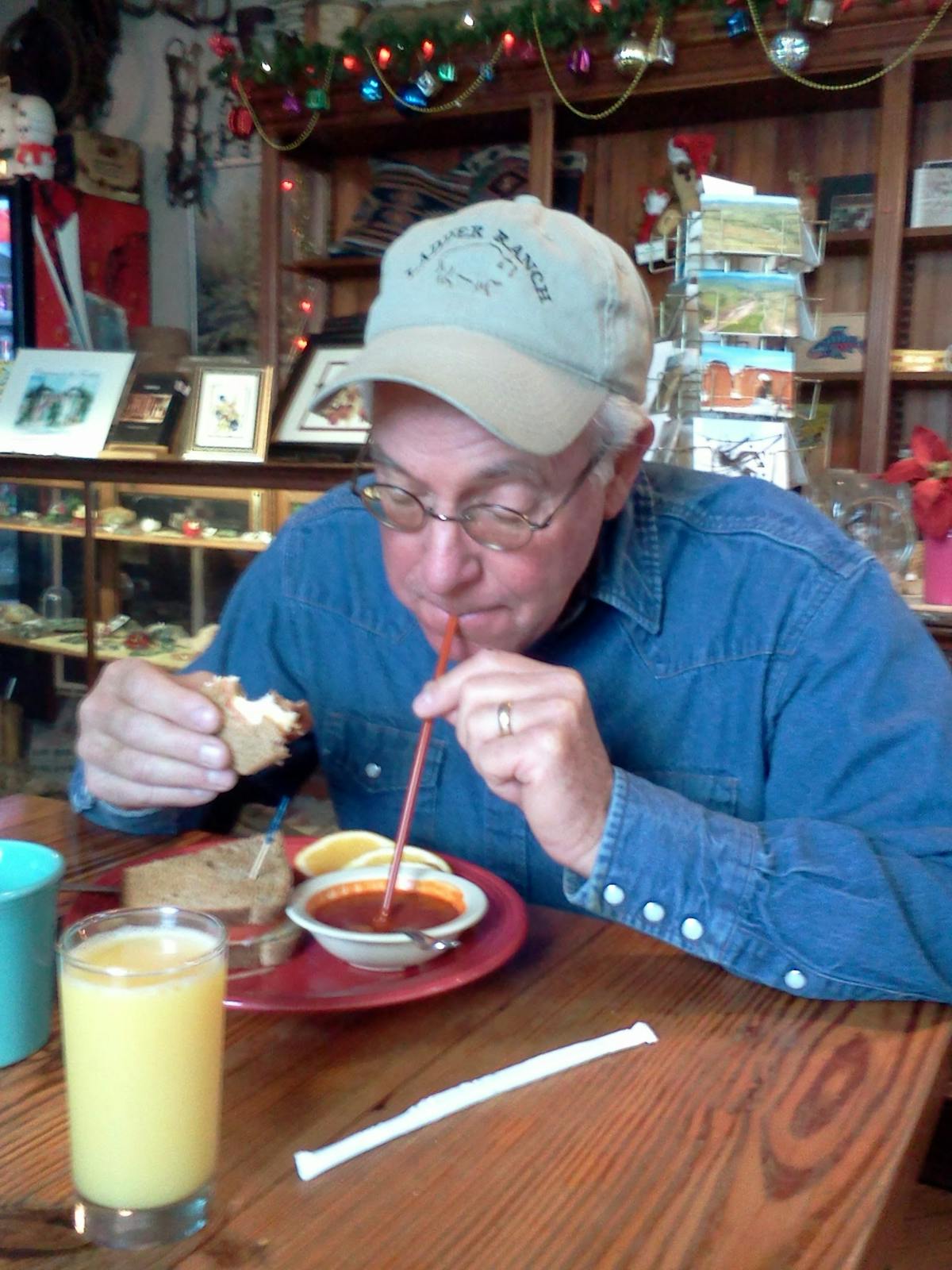 a woman sitting at a table eating food