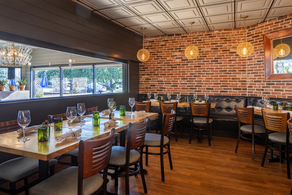 a dining room table in front of a window