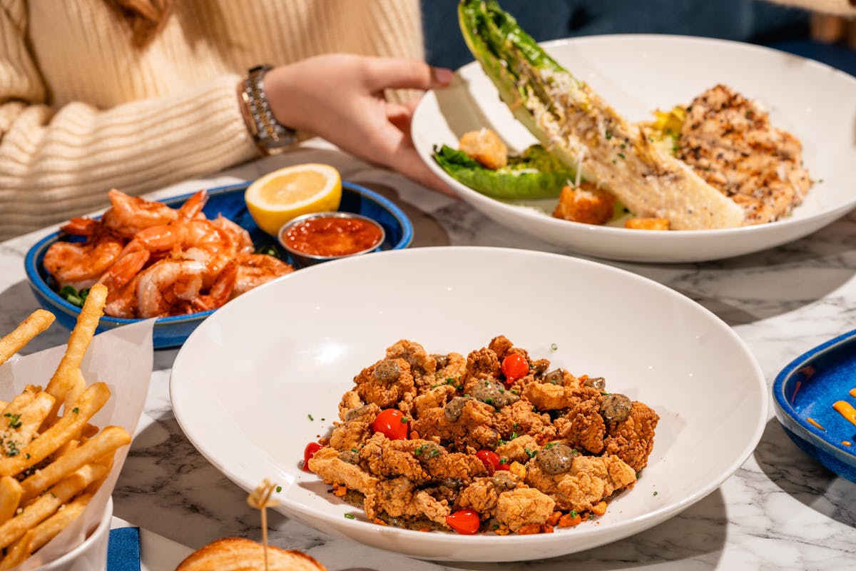 a plate full of food sitting on a table