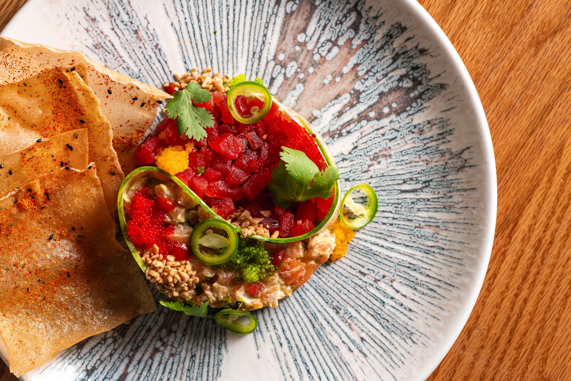 a plate of food on a wood table