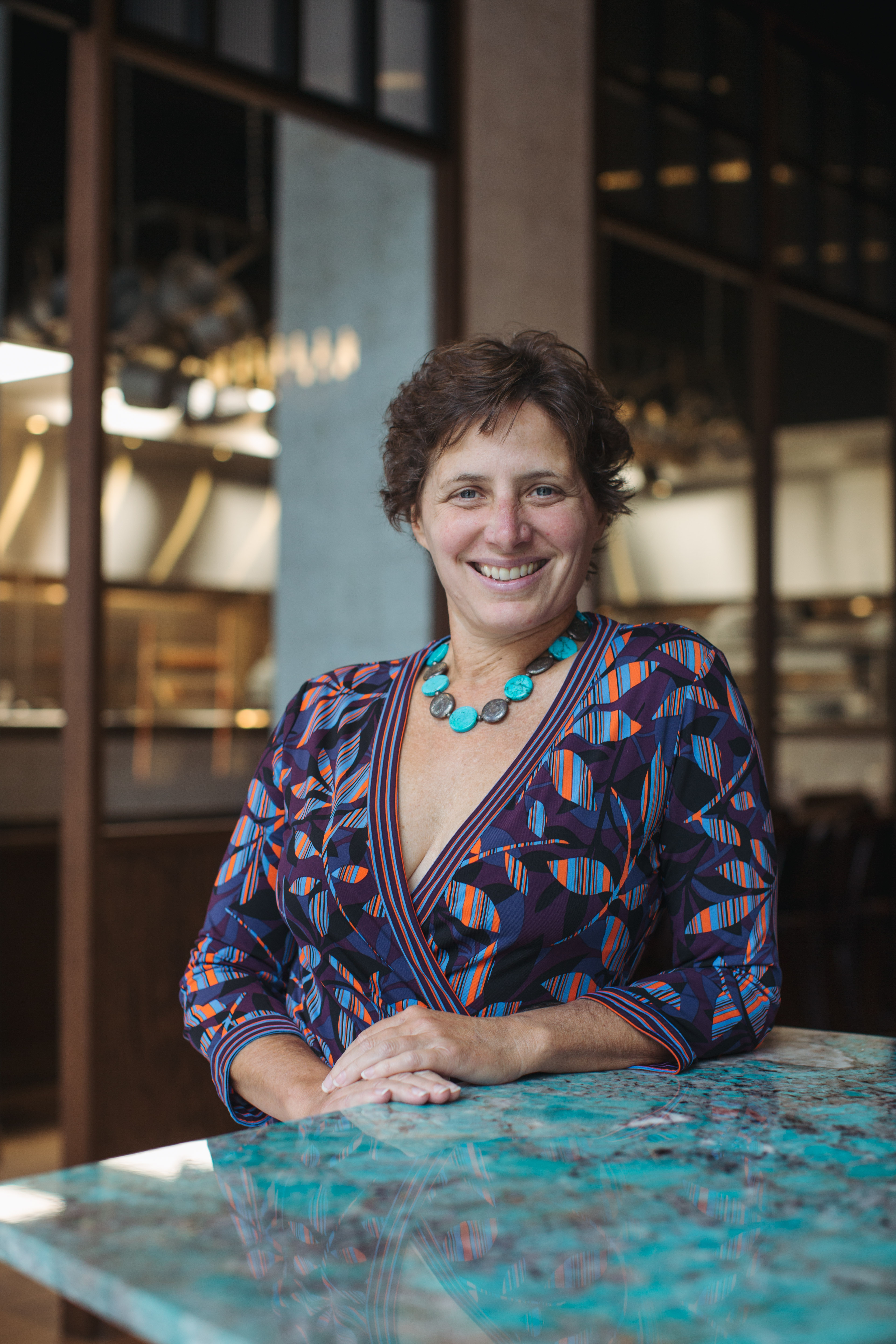 Jill Weber sitting at a table using a laptop