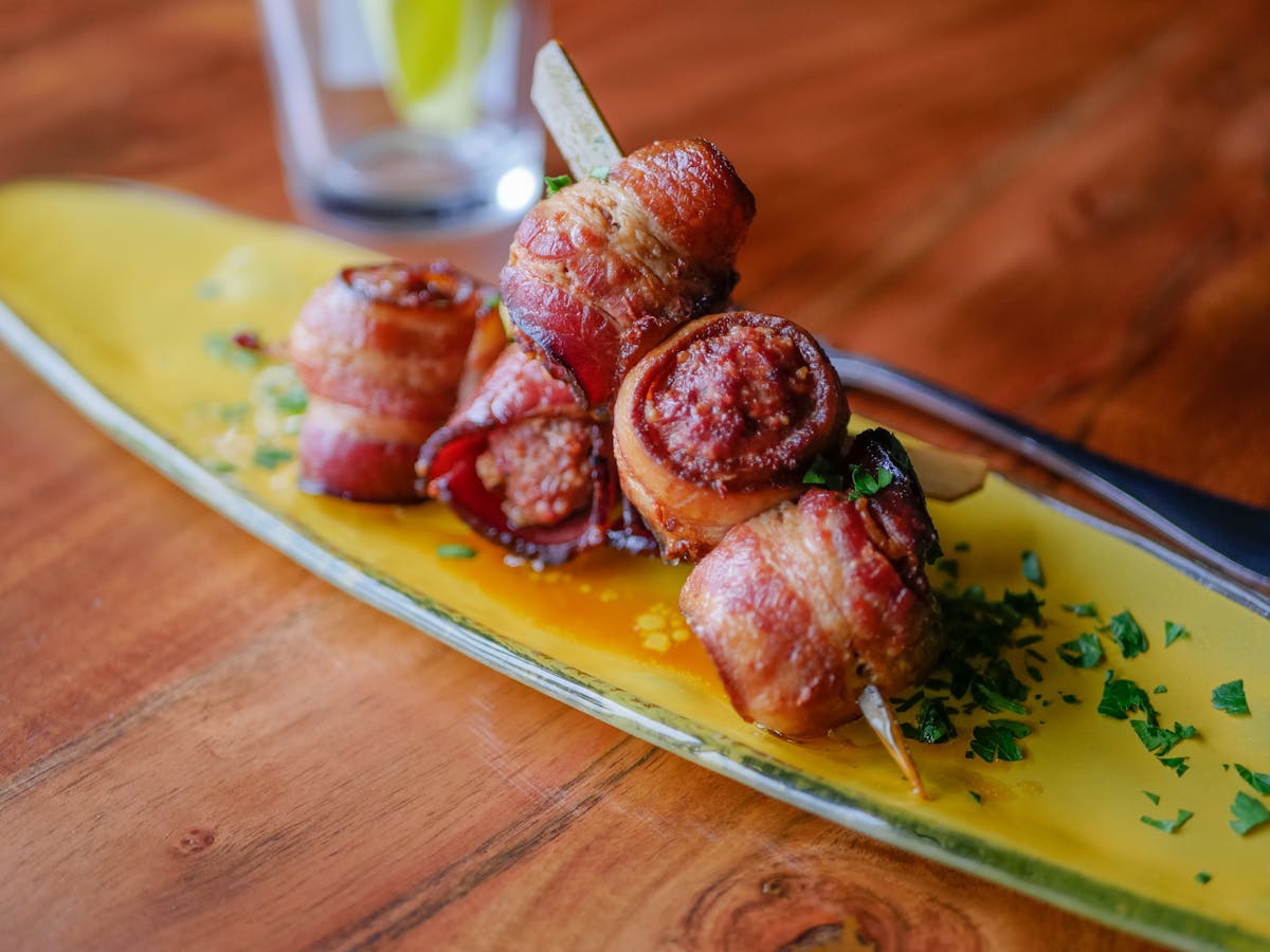 a plate of food sitting on top of a wooden table