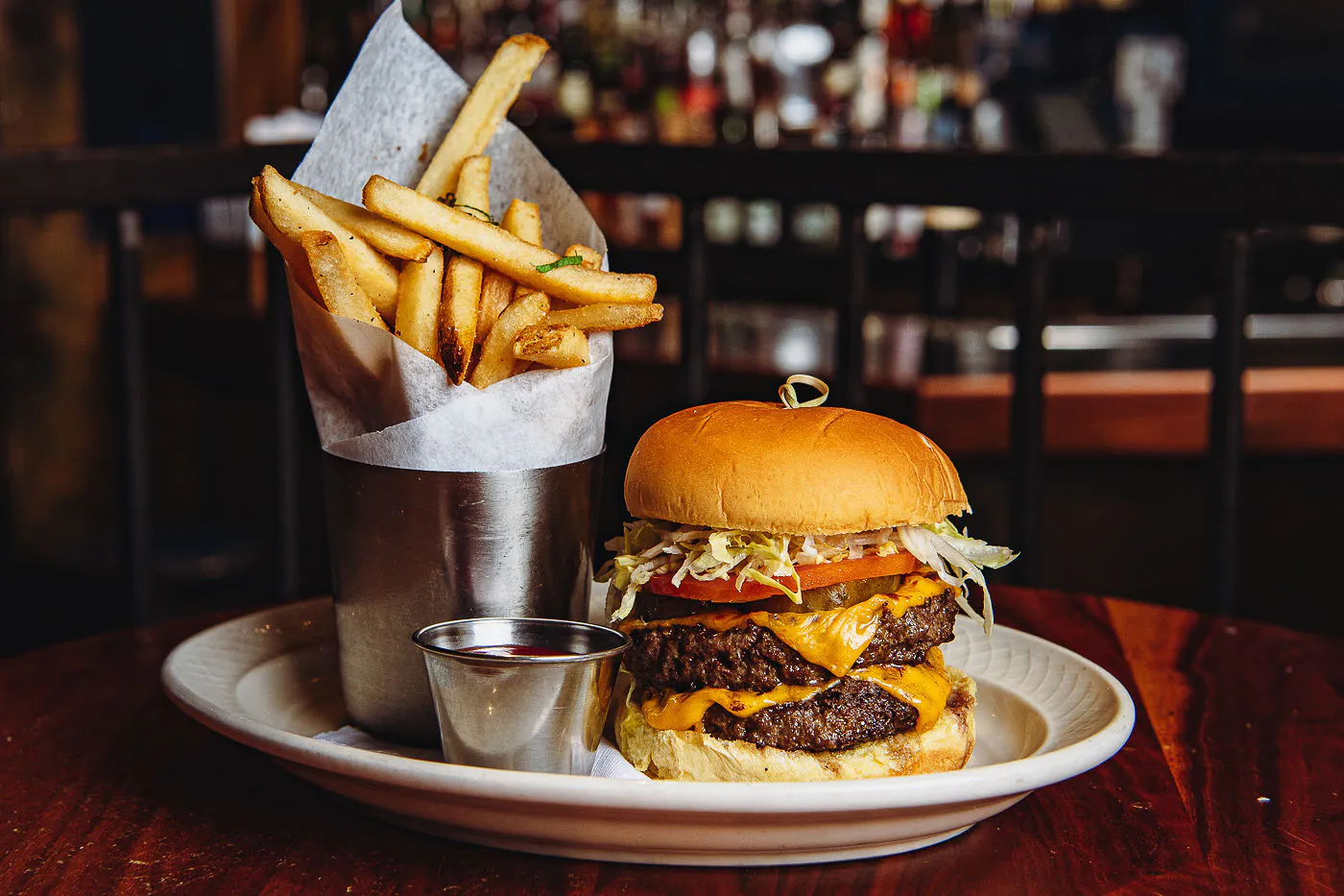 Official food photo at Ulysses; burger and fries, not lobster.