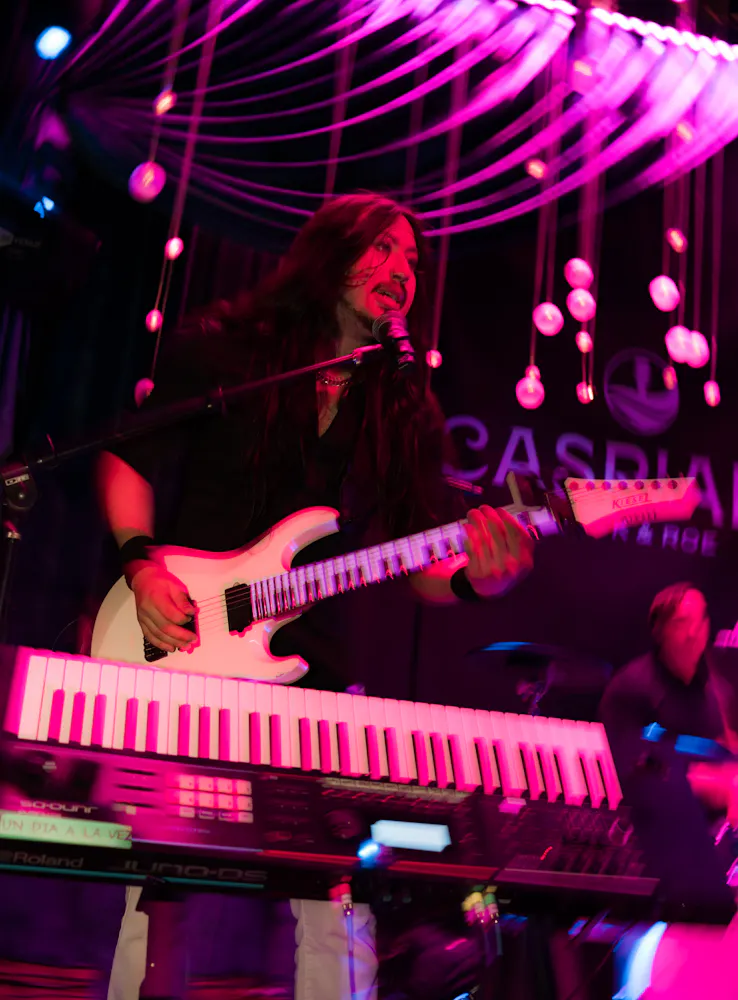 Band Member playing at Caspians Rock and Roe Spekeasy
