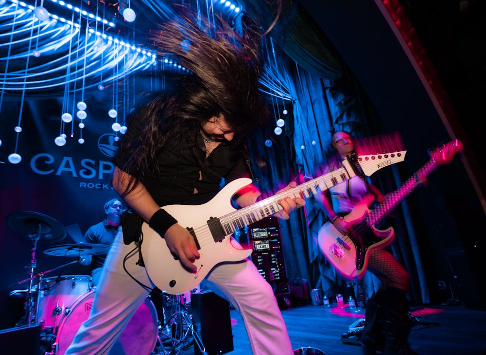 neon knights flipping hair rock and roll style at Las Vegas speakeasy, caspians