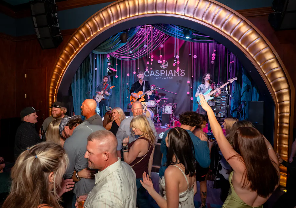 Band preforming inside Caspians Rock & Roe Speakeasy