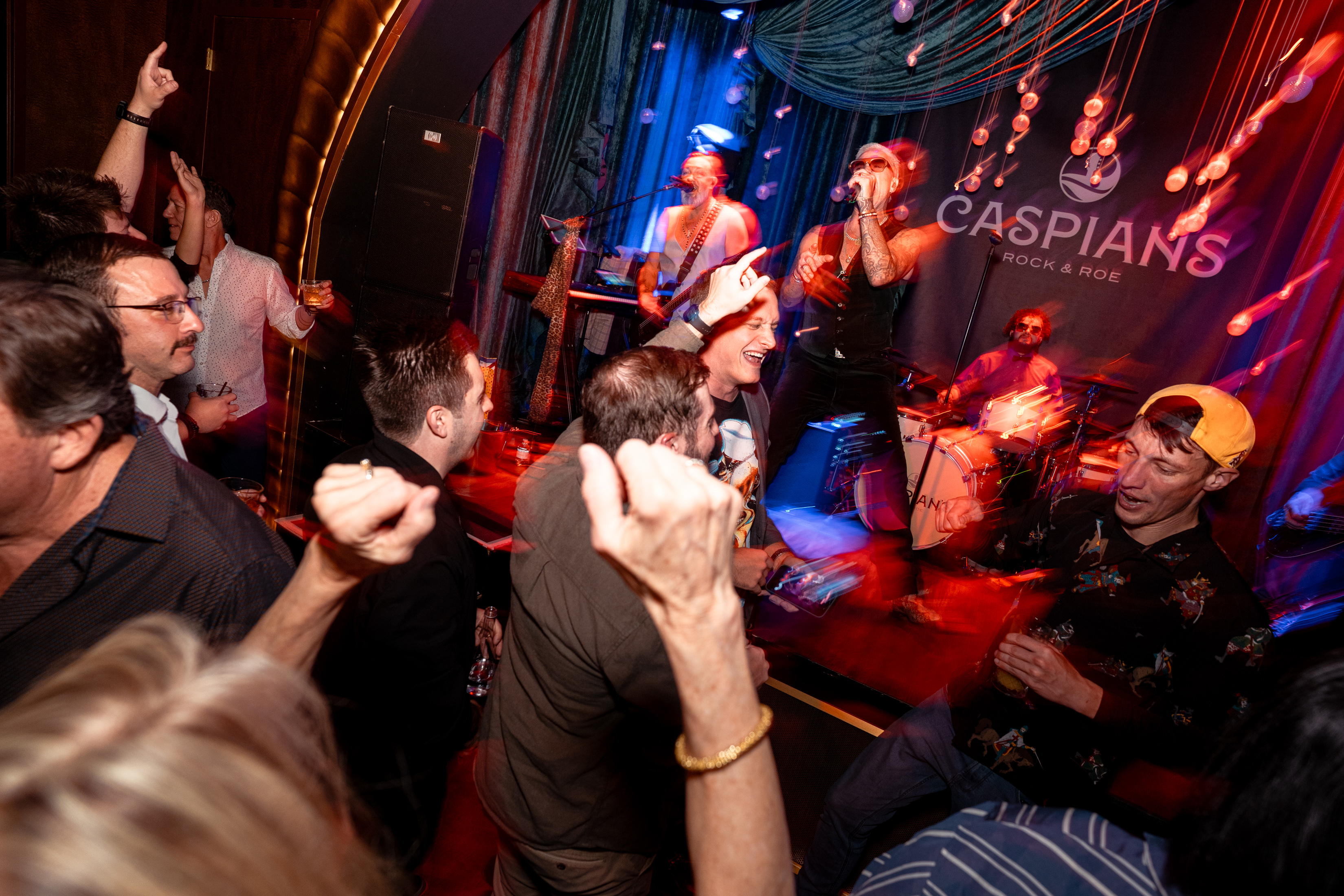 Crowd dancing at Caspian's Rock & Roe live music venue