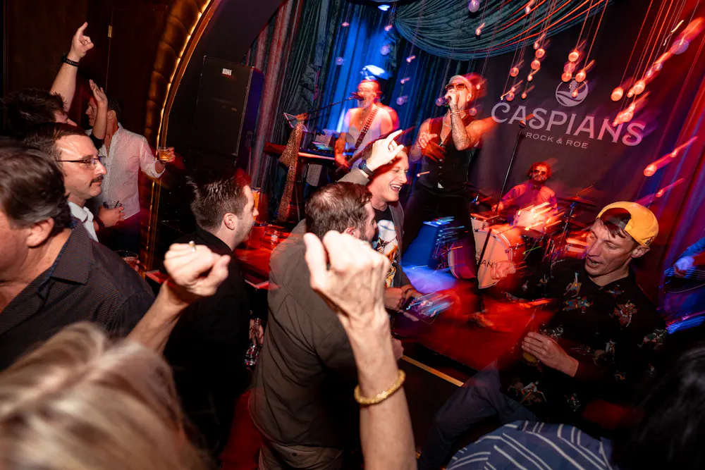 Crowd dancing at Caspian's Rock & Roe live music venue